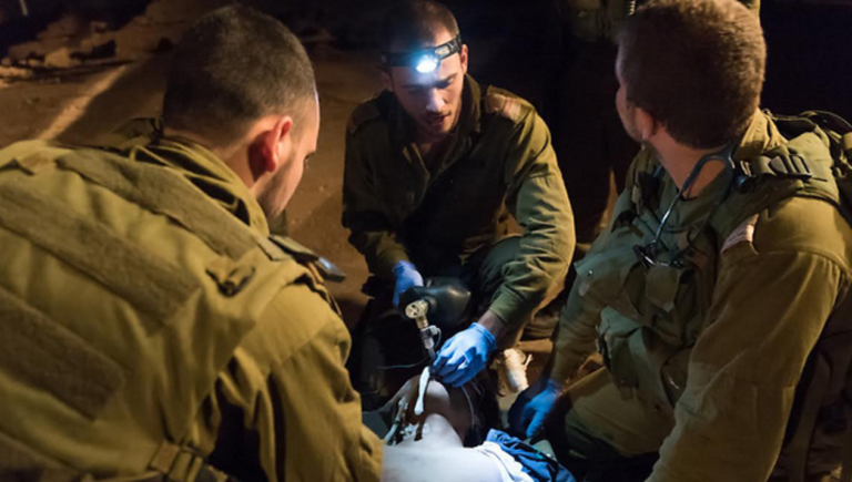 IDF Soldiers Help Syrians Arriving at Border in Need of Medical Care