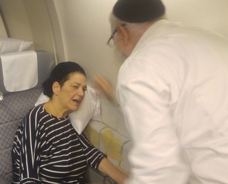 Paralyzed Rebbetzin & Mother of 7 Flies to China