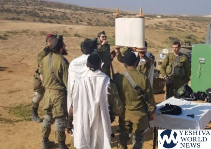 Chareidi soldiers take a break from advanced training to daven