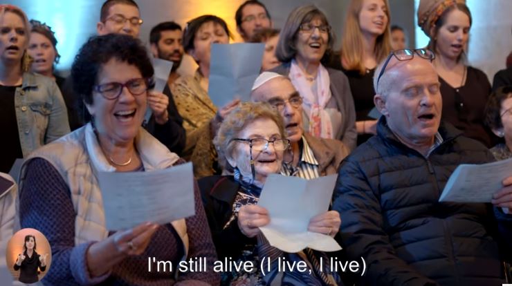 L”chaim! – 600 Holocaust Survivors and Families Celebrate Life with Song ‘Chai’ by Ofra Haza