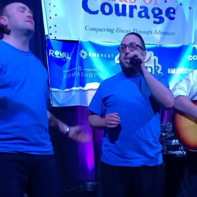 Noiky Roberts from Gibraltar performing with Lipa Schmeltzer at kids of courage Motzai Shabbos